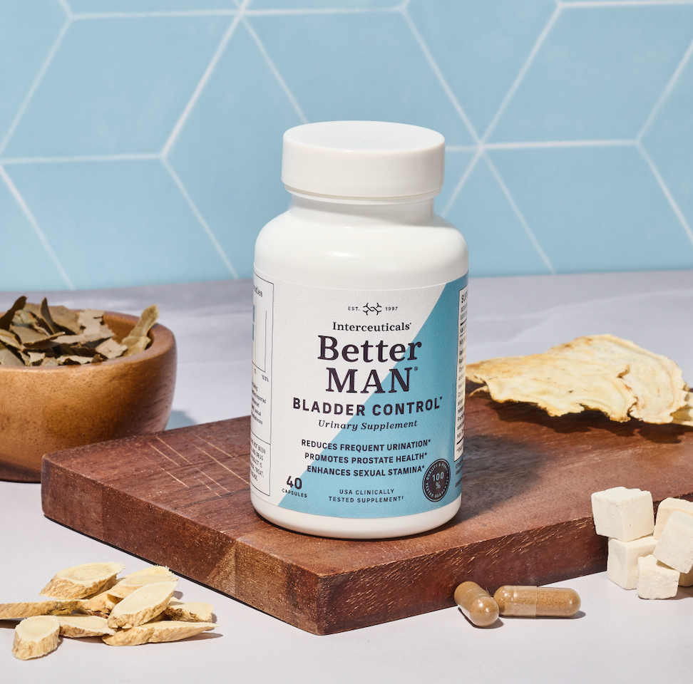 Option 1 (Heritage & Premium Focus): "BetterMAN bladder control supplement bottle displayed on a wooden board with raw, traditional herbal ingredients, highlighting its natural formula for prostate health and male vitality