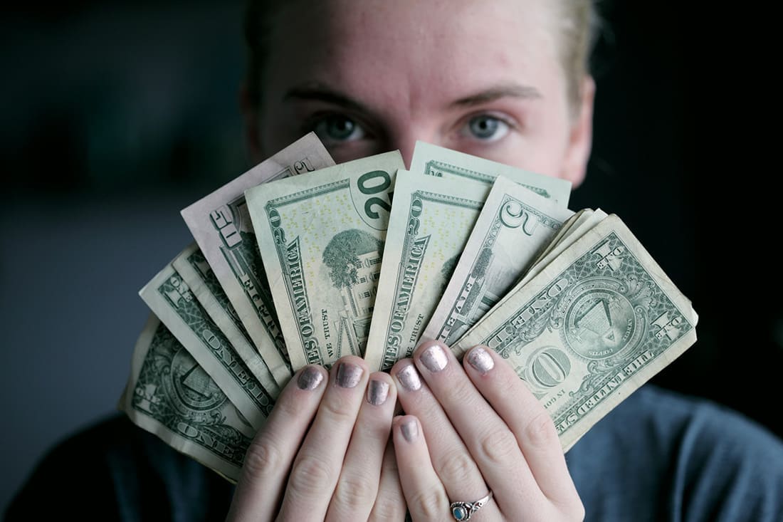 A person holding cash