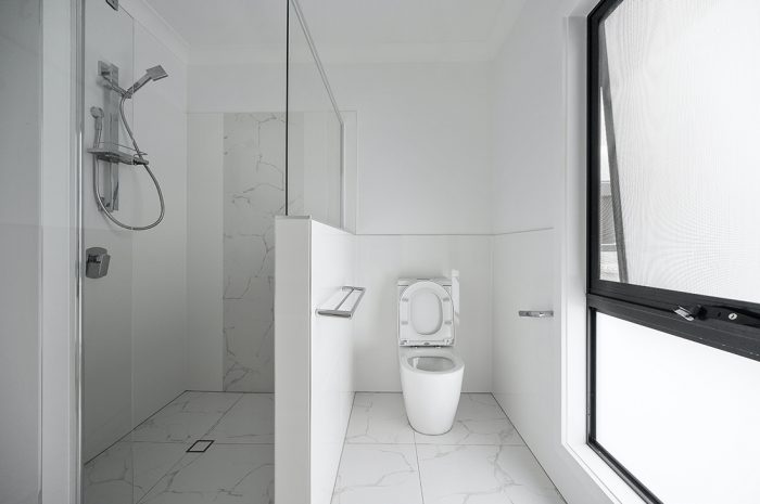 Bathroom with handrails